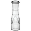 Clear polycarbonate carafe with decorative patterns on a white background from Baci Milano
