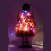Holiday Magic Mae doll featuring hidden twinkle lights in her red tulle coat back view lit for night 