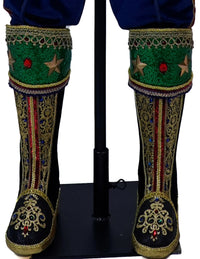 Decorative tasseled boots on Baron Wintermarch life-size Christmas nutcracker