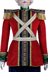 Red and blue velvet uniform with jeweled trim on Baron Wintermarch life-size nutcracker