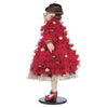 left hand view of the katherines collection handcrafted Holiday Magic Mae luxury doll with jeweled poinsettias and plaid dress.