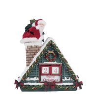 Snow-covered rooftop with garlands, plaid bows, and ornaments