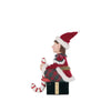 left side view of Holiday Magic Sitting Elf with velvet gift and candy cane stocking holder