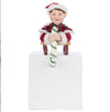 Front view of Katherine’s Collection Holiday Magic Laying Elf on Sled Stocking Holder