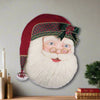 Decorative head of a Santa Claus with a red hat and plaid band on a white background