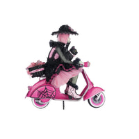 Collectible Halloween décor Rosalie on pink Vespa with spider web fenders and jeweled accents right side view
