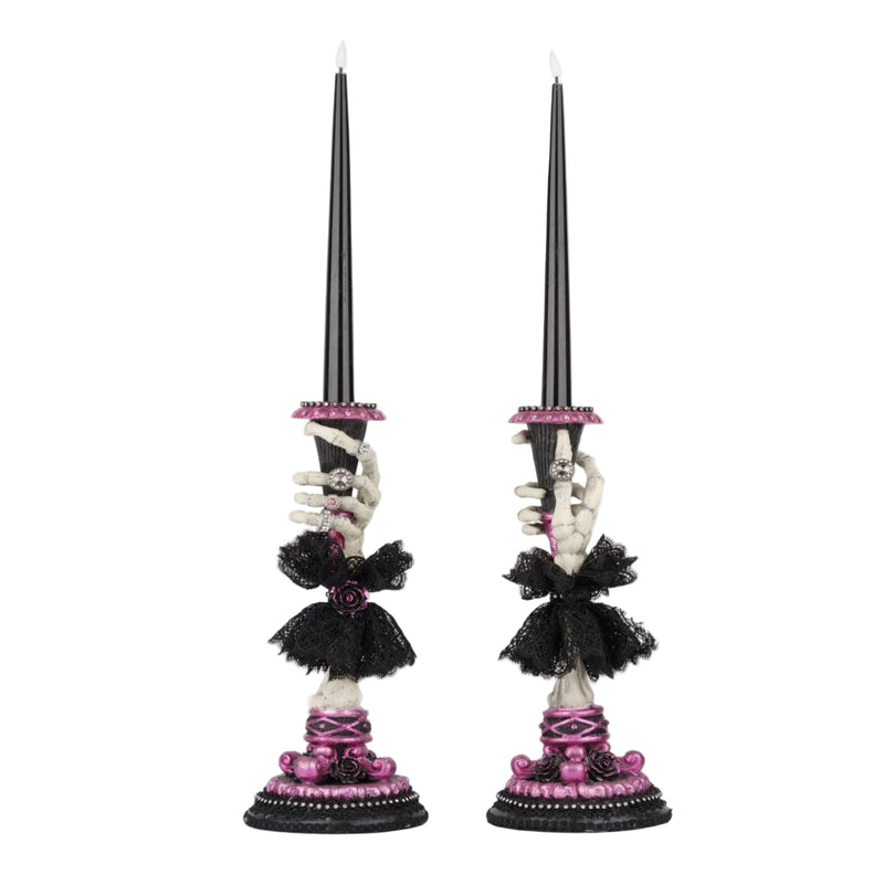 Detail of black battery-operated candle included with Katherine’s Collection Skeleton Hand Candle Sticks set