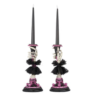 Side B view of Katherine’s Collection Skeleton Hand Candle Stick, resin skeleton hand holding battery-operated black candle.
