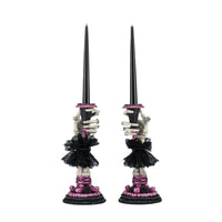 Side view one of Katherine’s Collection Skeleton Hand Candle Stick, resin skeleton hand holding battery-operated black candle.