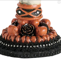 close-up of Katherine’s Collection Skeleton Hand Candle Stick base showing jeweled embellishments and lace sleeves