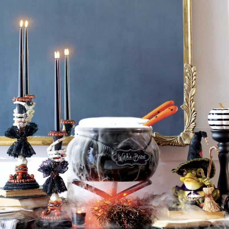 Katherine’s Collection Skeleton Hand Candle Sticks set of 2 displayed on mantel, gothic Halloween home décor and other Katherines collection items