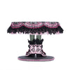 Back view of Katherine’s Collection Witch Boots Cake Plate, highlighting handcrafted details and beaded embellishments.