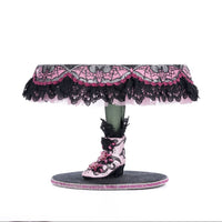 Left side view of Katherine’s Collection Witch Boots Cake Plate, showing hand-painted witch boot base with rhinestone accents