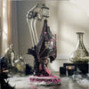 Katherine’s Collection Lacey Bat Luminary displayed on a Halloween mantel, handcrafted gothic décor piece with lace wings