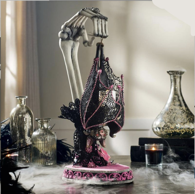 Katherine’s Collection Lacey Bat Luminary displayed on a Halloween mantel, handcrafted gothic décor piece with lace wings