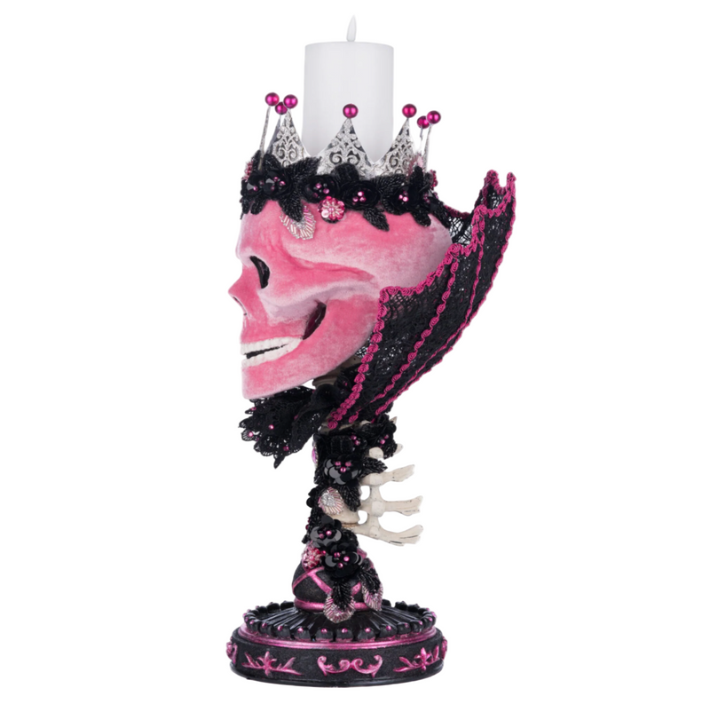 Katherine’s Collection Item 28-428155 Skull Pillar Candle Holder with candle.