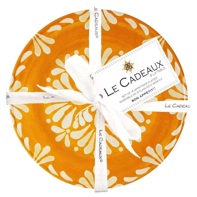 Round appetizer plates gift set with a  orange and white floral pattern, tied with white ribbon, on a white background. Brand 'Le Cadeaux' visible.
